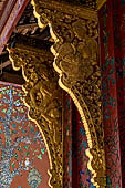 Wat Xieng Thong temple in Luang Prabang, Laos. the Ho Tai, the library. Detail of the console of the roof. 